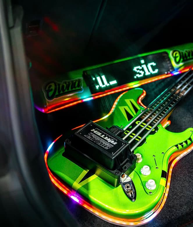 Stuart Hammond’s 2016 Audi A3 S line Sportback 2.0L TDI, with Air Lift Performance 3P, an air tank, and an Airguitar and a built-in fully functional Line6 guitar amp and hardline pipes positioned to look like guitar strings.